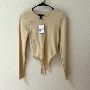 Beige Forever 21 bodysuit.